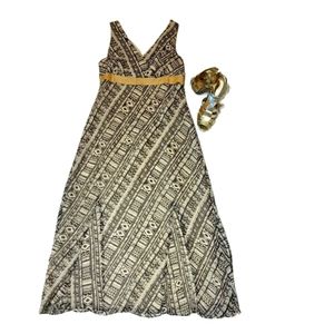 Metrostyle cream and black sheer dress with cream lining.  Deep plunge neckline.